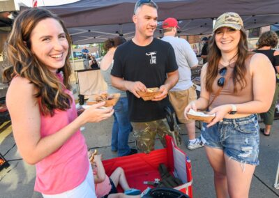 Three friends enjoy barbecue at Downtown Thursday Nights