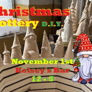 Christmas gnomes lined up on the edge of a pottery kiln