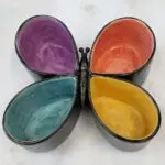 A multicolored ceramic serving dish shaped like a butterfly.