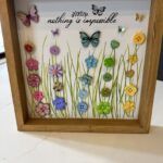 A deep frame with colorful button flowers