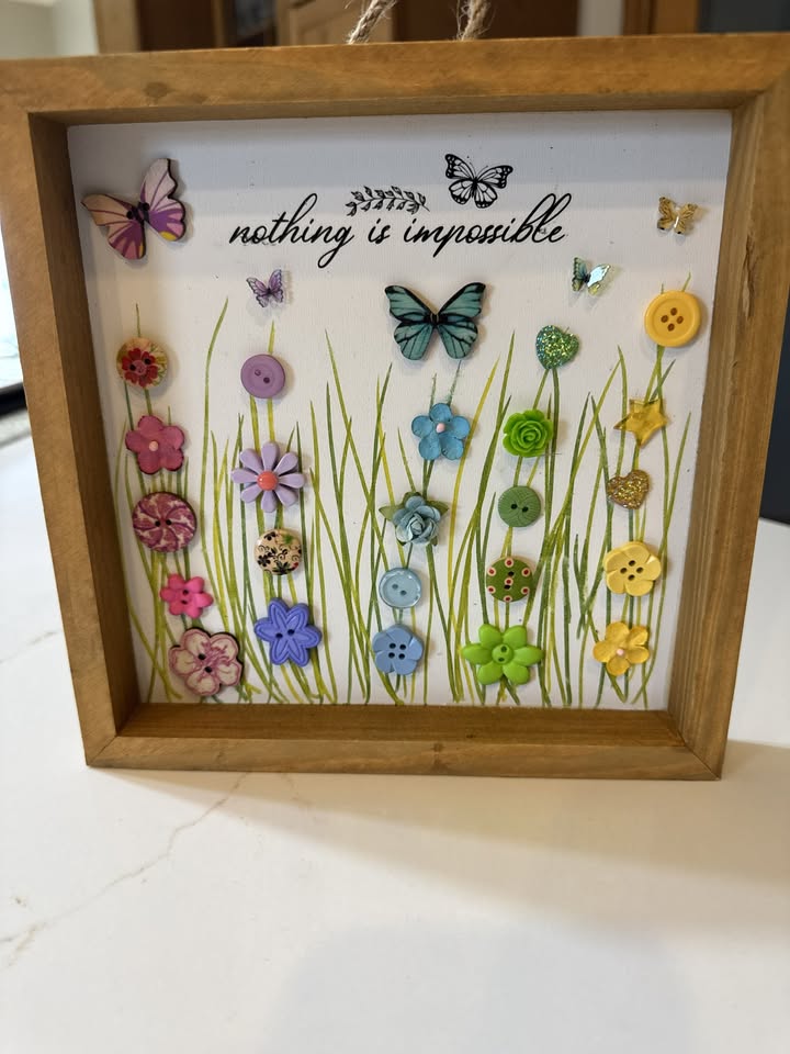 A deep frame with colorful button flowers