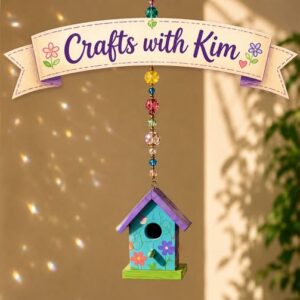 A small bird house hanging from a beaded line