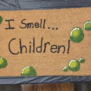 a welcome mat that says "I smell children"
