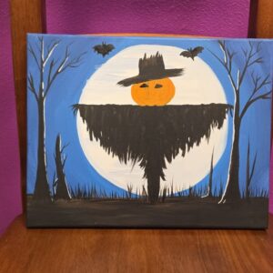 A canvas painting of a scarecrow in front of the full moon.